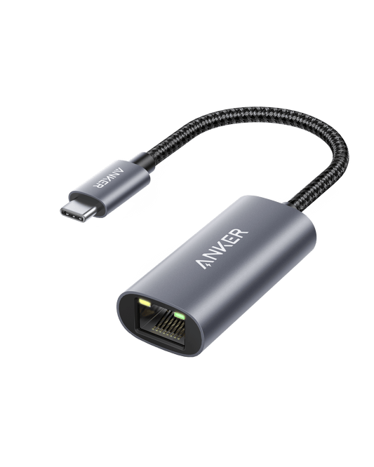 Anker PowerExpand USB-C to Gigabit Ethernet Adapter in gray connected to a laptop for wired internet connection.