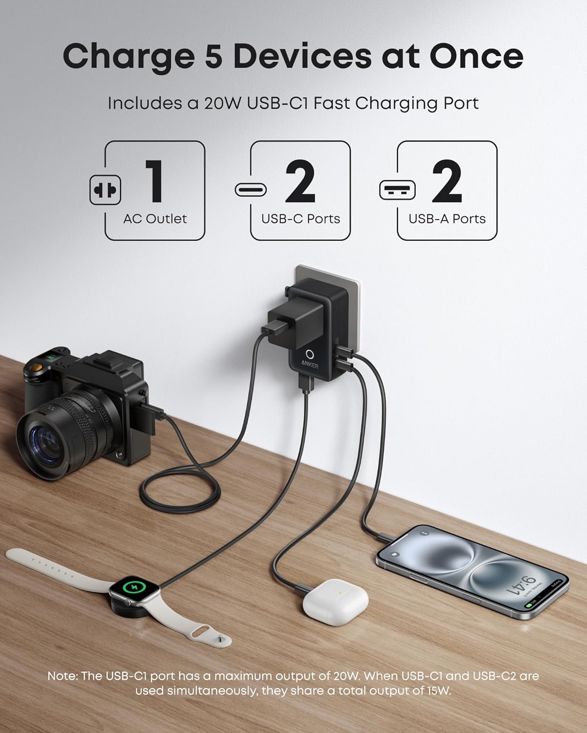 Anker 25K 165W laptop power bank in space black with built-in and retractable cables for portable charging.