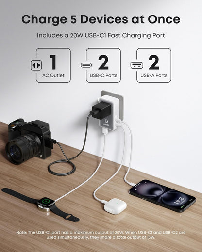 Anker 25K 165W space black laptop power bank with built-in and retractable cables for portable charging and high power output.