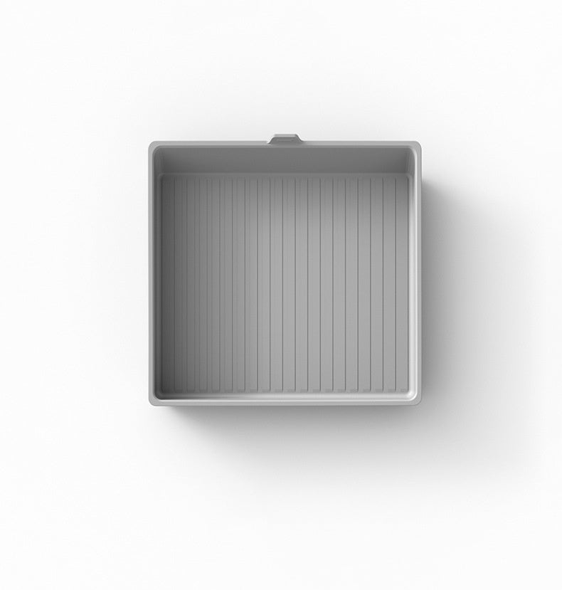 Silicone armrest box mat designed for Tesla Cybertruck, featuring textured surface and custom fit for interior protection.