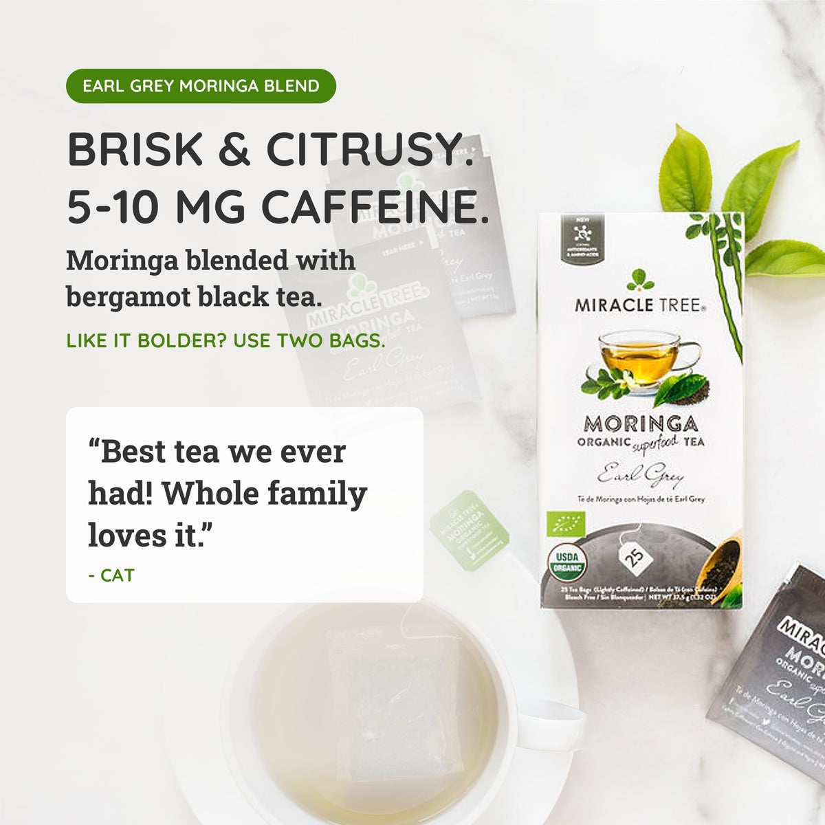 Organic Moringa Earl Grey herbal tea by Miracle Tree, featuring dried tea leaves in a clear glass cup with a lemon wedge.