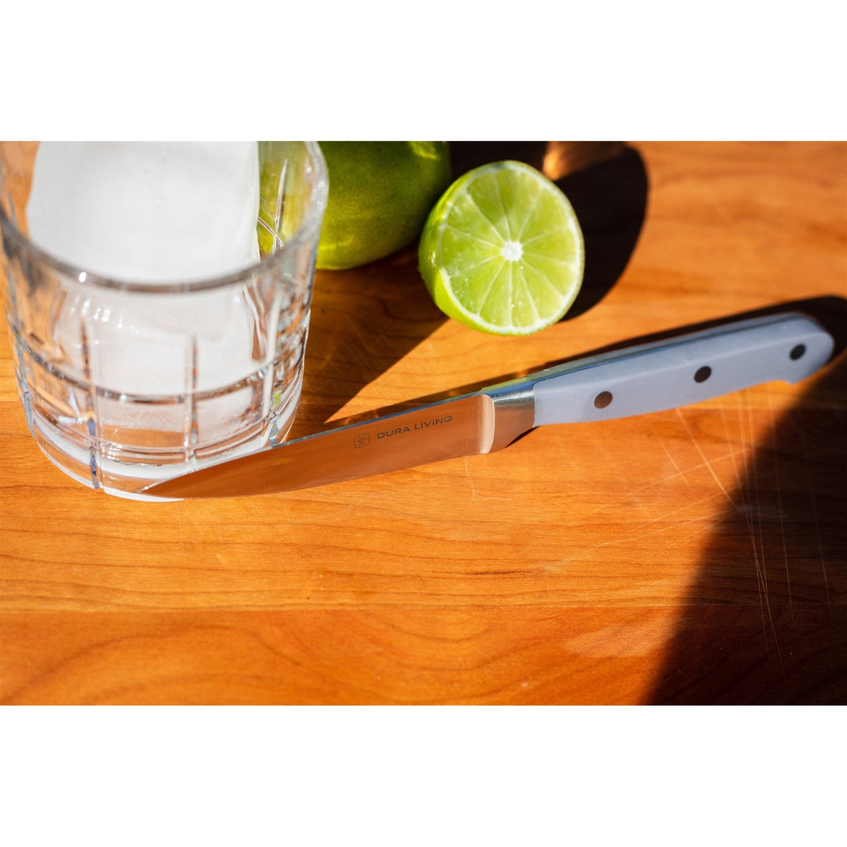 Dura Living Superior 2-piece gray kitchen knife set with stainless steel blades and ergonomic handles on a cutting board.