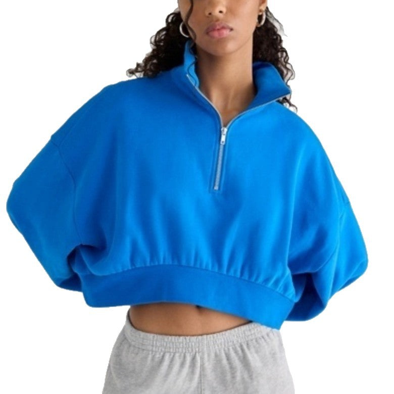 Women's half-zip lapel sweatshirt with loose fit, puff sleeves, and short pullover design