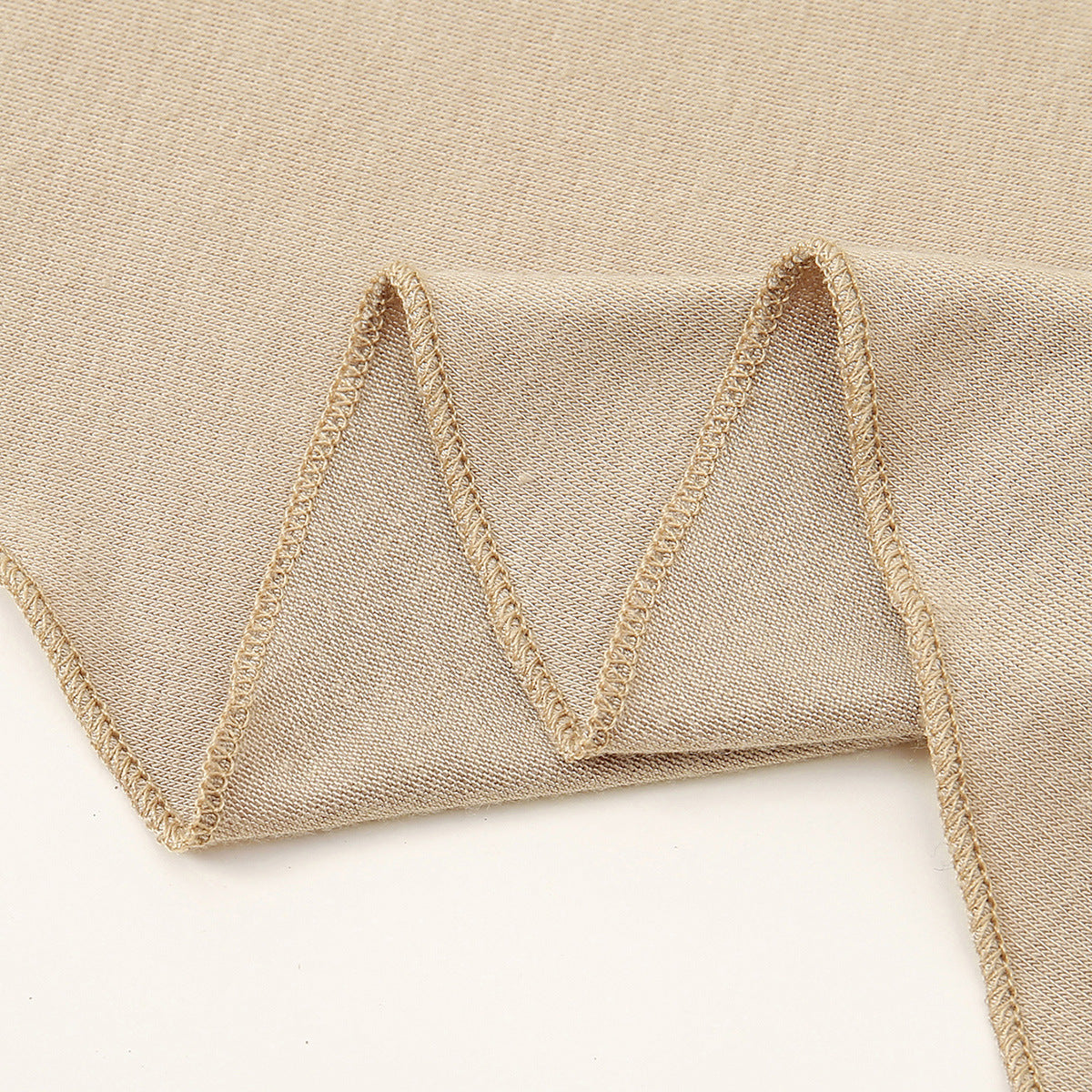 Women's versatile highly elastic soft ethnic headscarf, close-up view of stretch fabric and patterned design