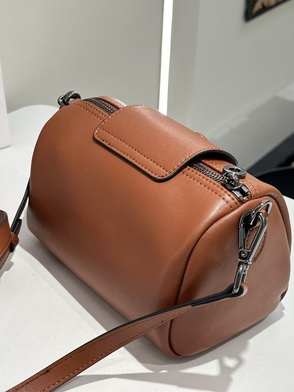 Urban minimalist leather shoulder and crossbody bag with pillow design, versatile work organizer style