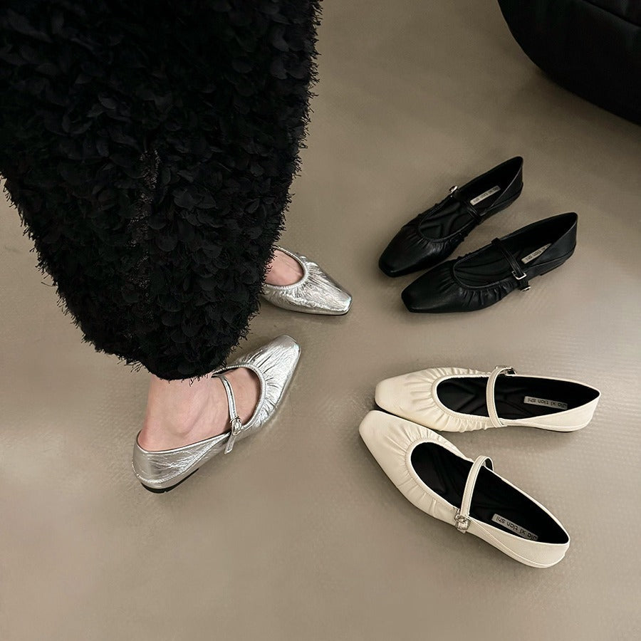 Women's silver flat dress shoes, elegant slip-on design with a smooth metallic finish