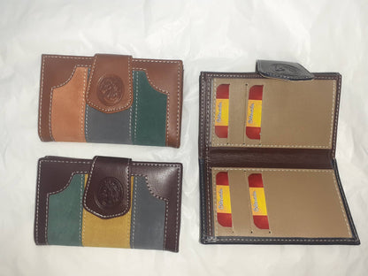 Handmade women's wallet with detailed stitching, featuring multiple card slots and a sleek leather finish.