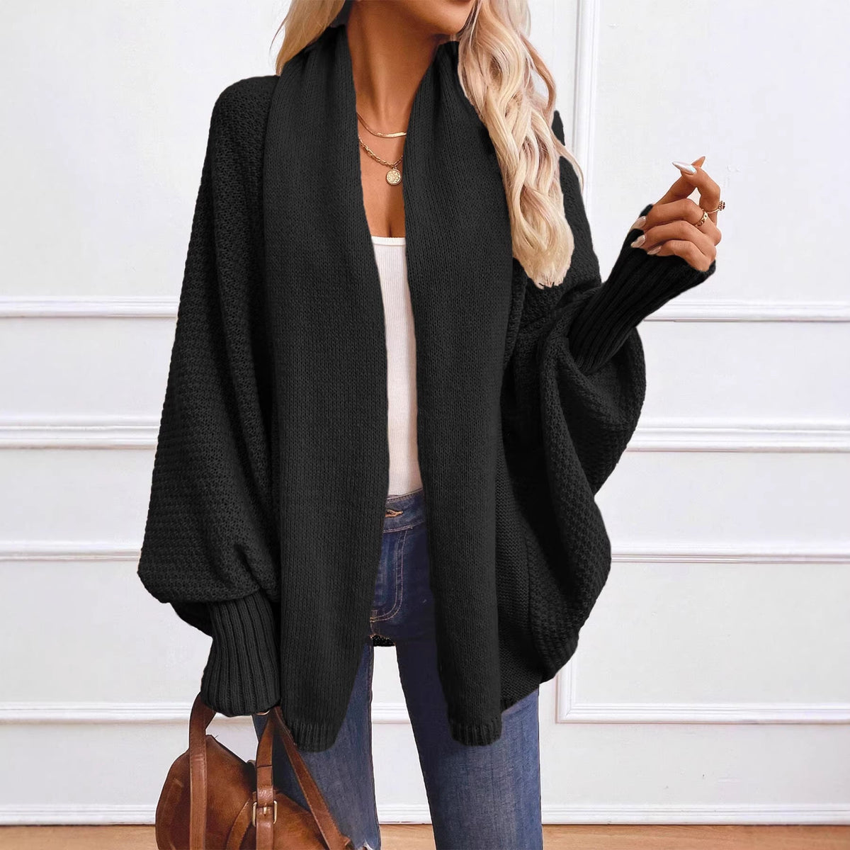 Solid-color women's knitted cardigan with large lapels and a loose fit
