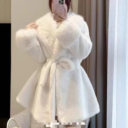 Women's winter fur coat, front view with long sleeves and plush texture