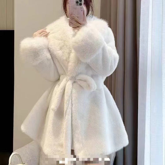 Women's winter fur coat, front view with long sleeves and plush texture