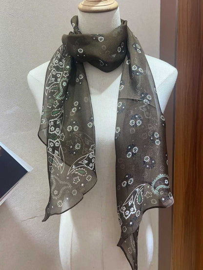 Spring lightweight narrow long silk scarf folded in a soft drape