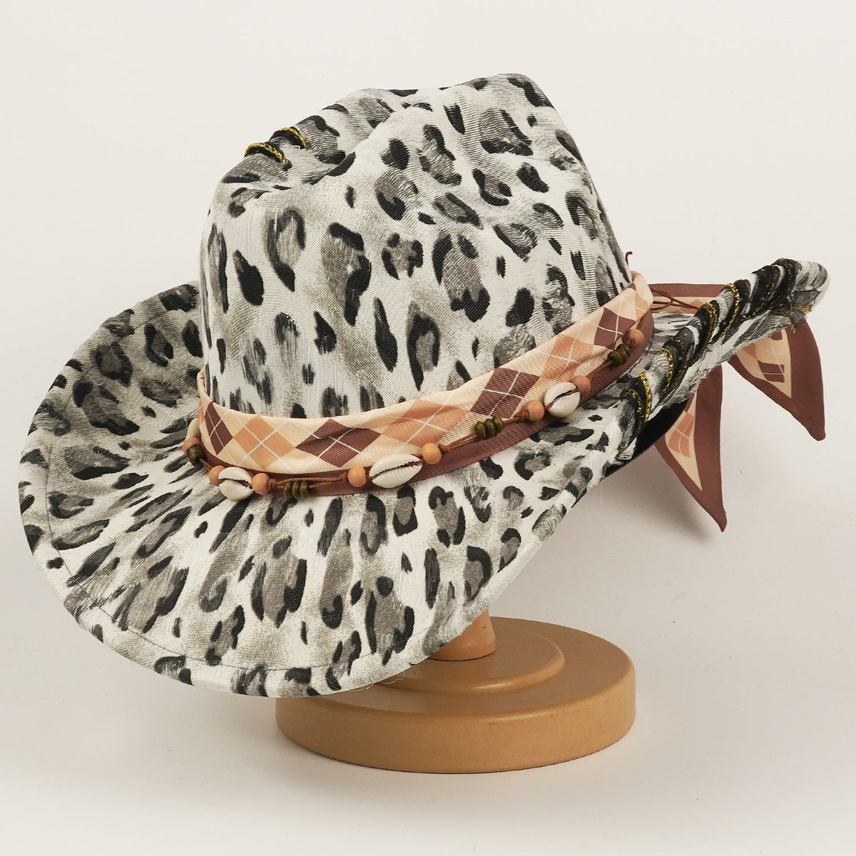 Leopard-print western cowboy hat with wide brim and structured top hat design