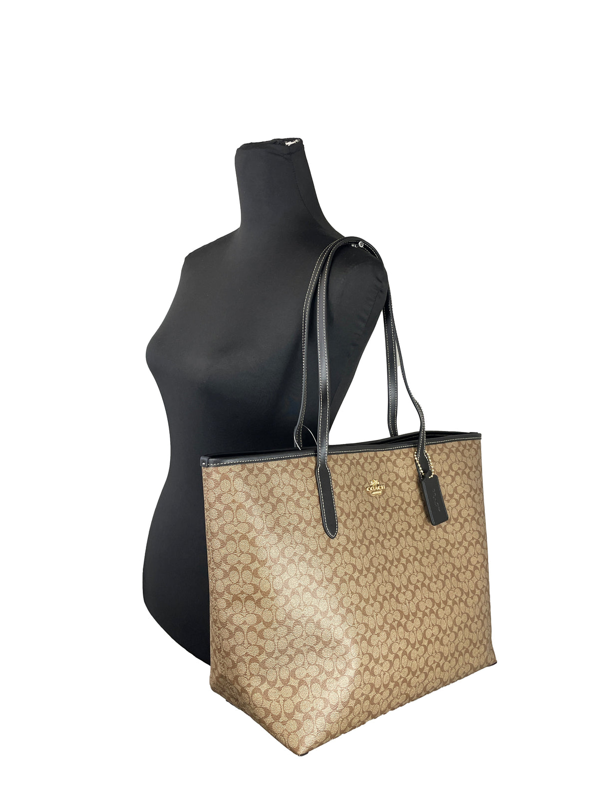 Coach CJ942 khaki Signature City Tote Bag, stylish purse with signature print and spacious interior, ideal for everyday use.