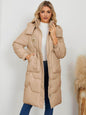 Women's long sleeve longline hooded winter coat by Trendsi, shown in a cozy, stylish design with a hood and extended length.