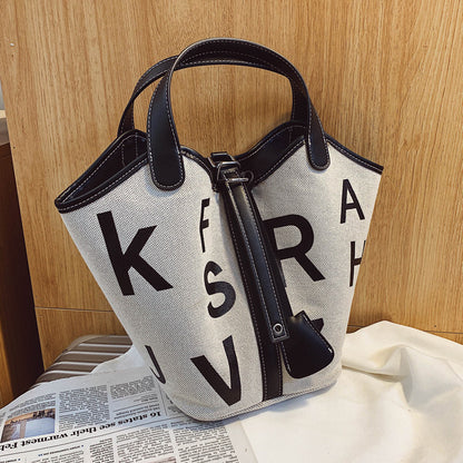 Women's letter printed canvas tote bag by BACKUPMYFILESNOW® featuring designer style, large print, sturdy handles, and spacious interior.