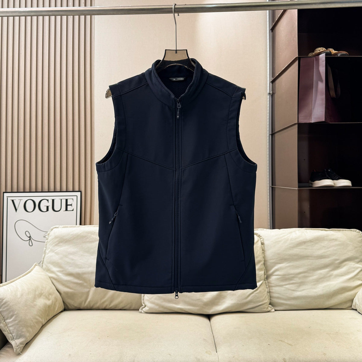 Men and women softshell vest with stand collar, zip front, fleece lining, and sleeveless outdoor design