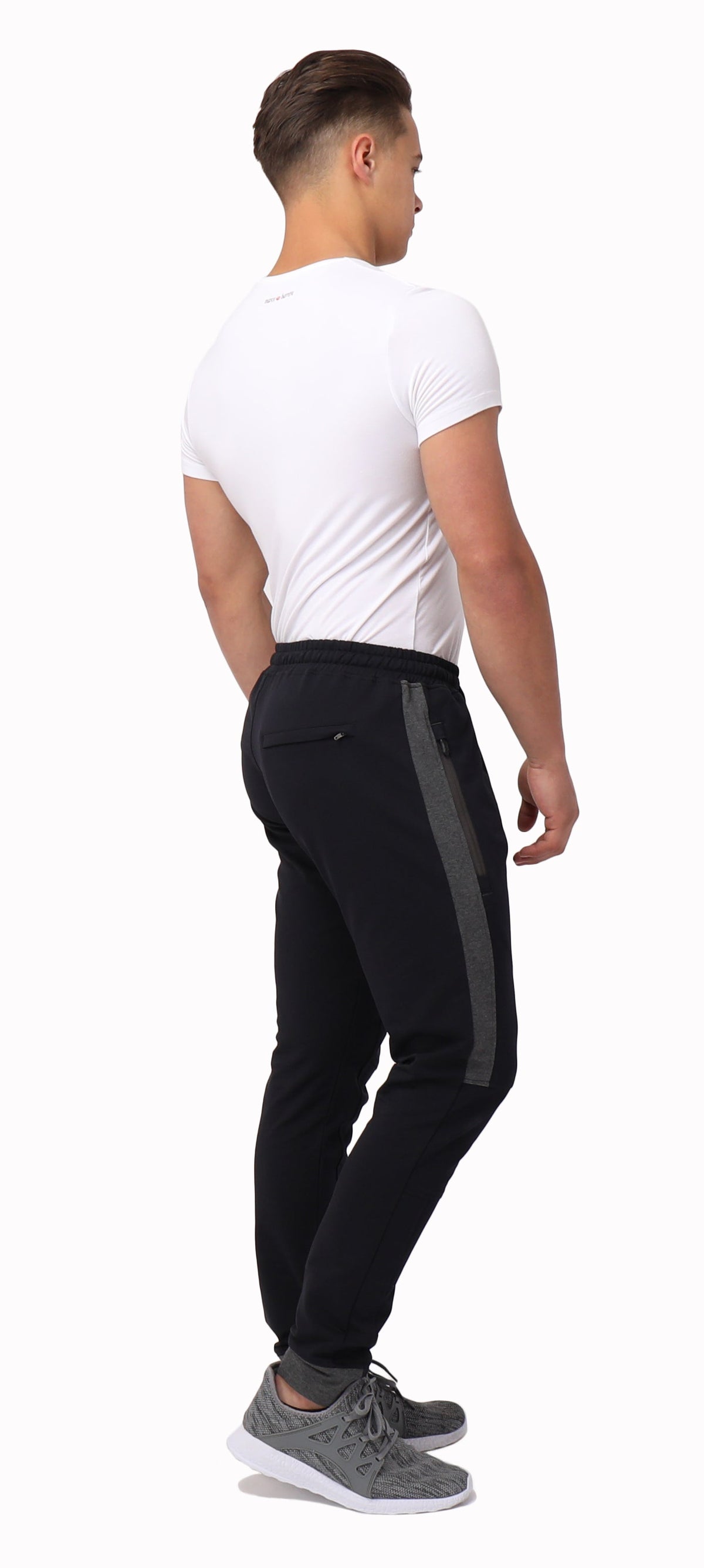 Back view of SCR Sportswear Infinite Flex Tall Fit men's joggers sweatpants in black with elastic waistband and tapered cuffs.