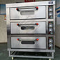 Commercial 3-deck, 6-tray gas bakery oven for baking bread and cakes, ideal for catering and professional baking use.