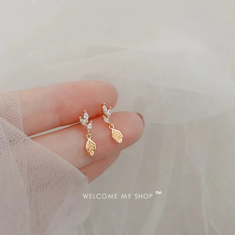 Korean fashion student leaves earrings for women with rhinestone tassel charms, perfect for weddings and party jewelry.