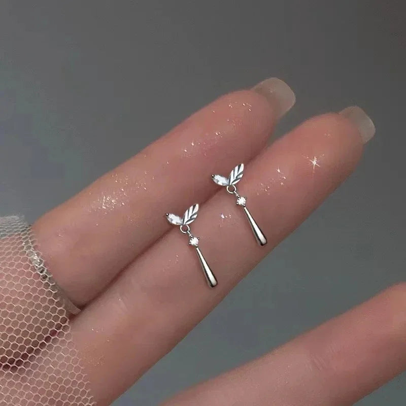 Korean fashion leaf earrings for women featuring rhinestone tassel charms, wedding and party jewelry, stylish and elegant.
