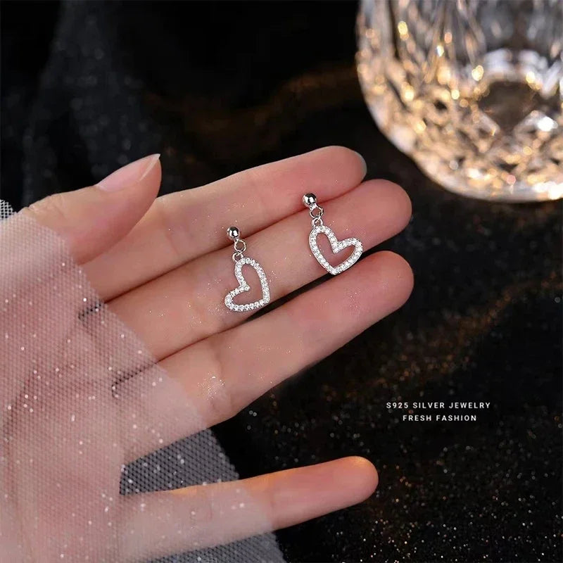 Korean fashion student leaf earrings for women with rhinestone tassel charms, suitable for wedding, party, or bridal jewelry.