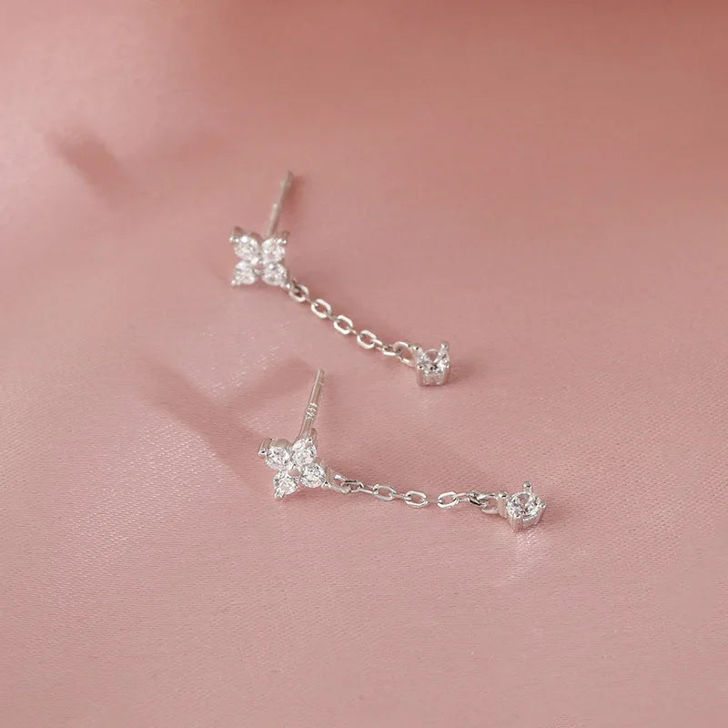 Silver color inlaid zircon clover tassel earrings for women featuring delicate chain pendants, perfect for party jewelry and gifts.