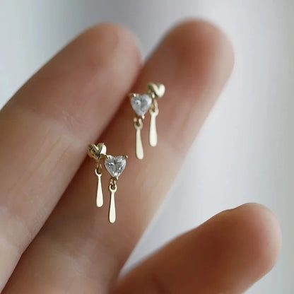 Silver color zircon inlaid clover tassel earrings for women, featuring delicate chain pendants and party jewelry design.