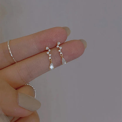 Silver color zircon inlaid clover tassel earrings for women, featuring delicate chain pendants, perfect for party jewelry and gifts.