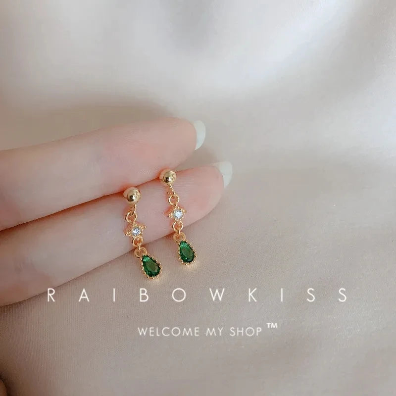 Silver inlaid zircon clover tassel earrings for women featuring delicate chain pendants, perfect for party jewelry and accessories.
