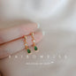 Silver inlaid zircon clover tassel earrings for women featuring delicate chain pendants, perfect for party jewelry and accessories.