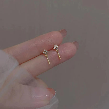 Silver color zircon clover tassel earrings for women with delicate chain pendants, stylish party jewelry accessory.