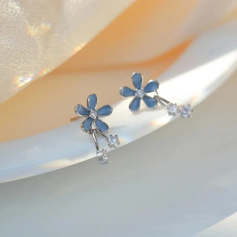 Silver inlaid zircon clover tassel earrings for women with delicate chain pendants, stylish party jewelry and accessories.