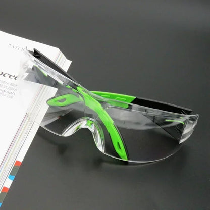Unisex anti-splash goggles by BACKUPMYFILESNOW.COM® with clear lens, designed for industrial safety, cycling, and windproof dust protection.
