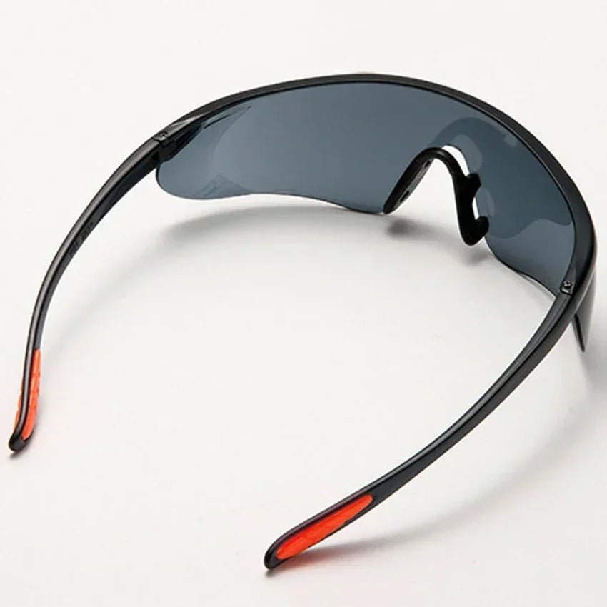 Unisex universal anti-splash safety goggles with clear lens, designed for industrial eye protection, cycling, windproof and dustproof.
