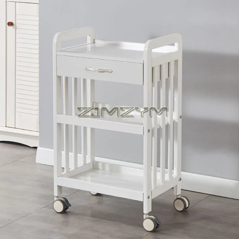 White modern beauty salon trolley cart with wheels, movable storage rack and drawers for salon tools and accessories.