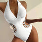Royal blue women's monokini swimsuit with hollow out design, deep V neck, high waist, padded, and see-through details.
