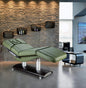 Dark gray electric 4-motor beauty spa bed with facial cushion for salon treatments, featuring adjustable sections for client comfort.