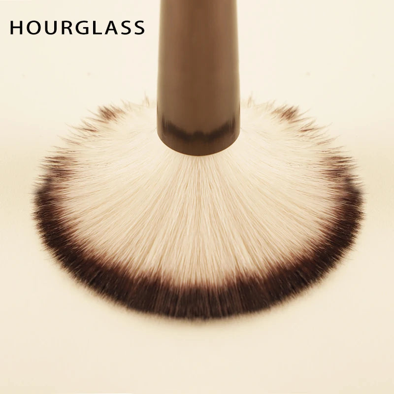 Hourglass makeup brush set with retractable professional brushes for eyeshadow, foundation, concealer, powder, bronzer, and blush.
