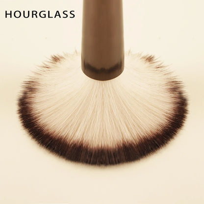 Hourglass makeup brush set with retractable professional brushes for eyeshadow, foundation, concealer, powder, bronzer, and blush.