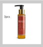 Three 100ml bottles of BackupMyFilesNow.com soothing body oil, showing clear glass bottles with golden oil inside.
