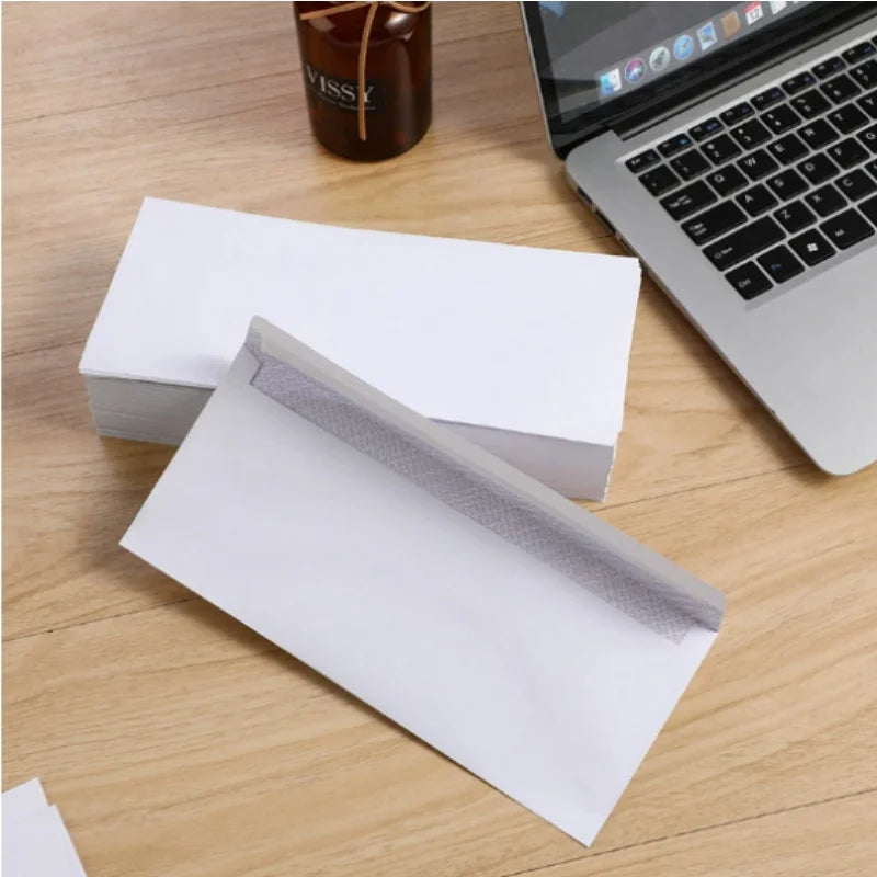 Set of 10 white windowless business envelopes from BackupMyFilesNow.com, self-sealing, suitable for A4 bills and invoices.