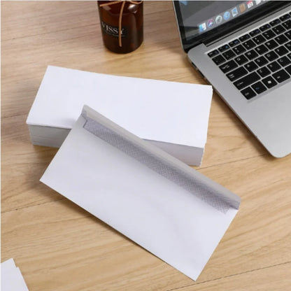 Set of 10 white windowless business envelopes from BackupMyFilesNow.com, self-sealing, suitable for A4 bills and invoices.
