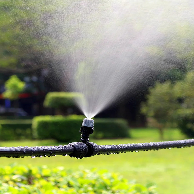 Set of 10 plastic garden watering irrigation misting sprinkler heads with nozzles and T-joint fittings for irrigation systems.