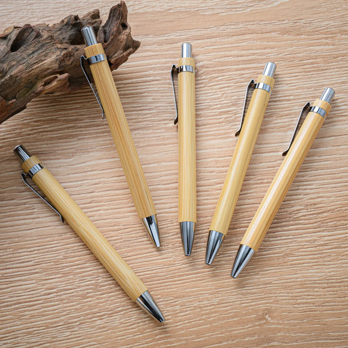 Set of 10 blue bamboo ballpoint pens for office, school, or party use, featuring natural bamboo barrels and metal tips.