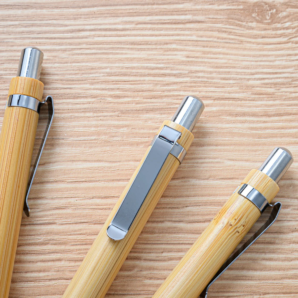 Set of 10 blue bamboo ballpoint pens for office, school, or party use, featuring natural bamboo barrels and reliable ink.