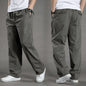 Men's black cotton cargo pants with relaxed fit, featuring multiple pockets, casual style, suitable for work, climbing, and outdoor activities.