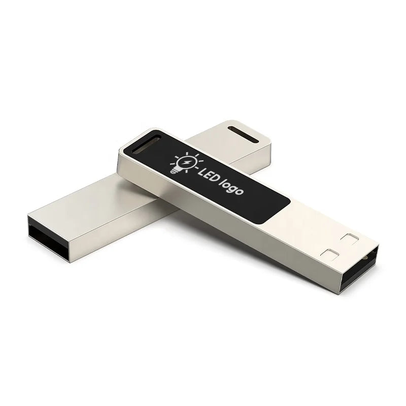 Silver USB flash drive with glowing logo, 16GB capacity, designed for photo storage and external data backup.