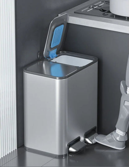 Double 9L stainless steel trash can with lid and pedal, suitable for kitchen, bathroom, or bedroom waste disposal.