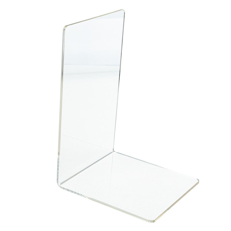 A clear acrylic desktop book stand from BACKUPMYFILESNOW.COM® holding an open book for easy reading and display.