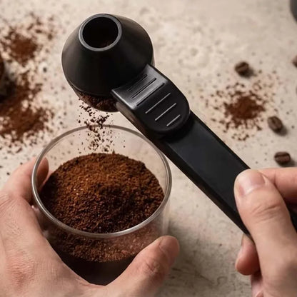 White leakproof coffee scoop with sliding mechanism, large capacity, perfect for measuring coffee, protein, or milk powder in the kitchen.